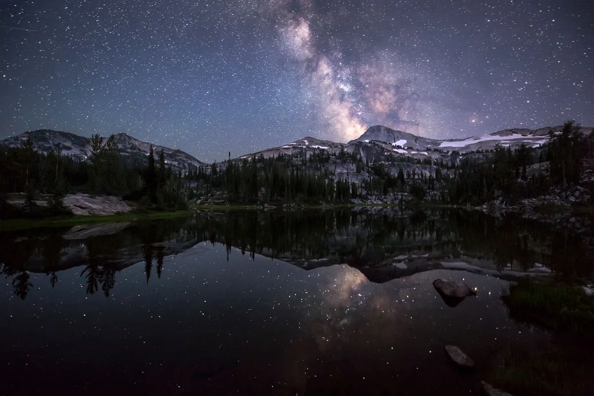 Eagle Cap Wilderness in Northeast Oregon featuring the Milky Way reflecting on a lake above Glacier Peak and reflects off Moccasin Lake.