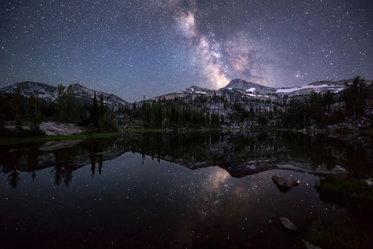 Eagle Cap Wilderness in Northeast Oregon featuring the Milky Way reflecting on a lake above Glacier Peak and reflects off Moccasin Lake.
