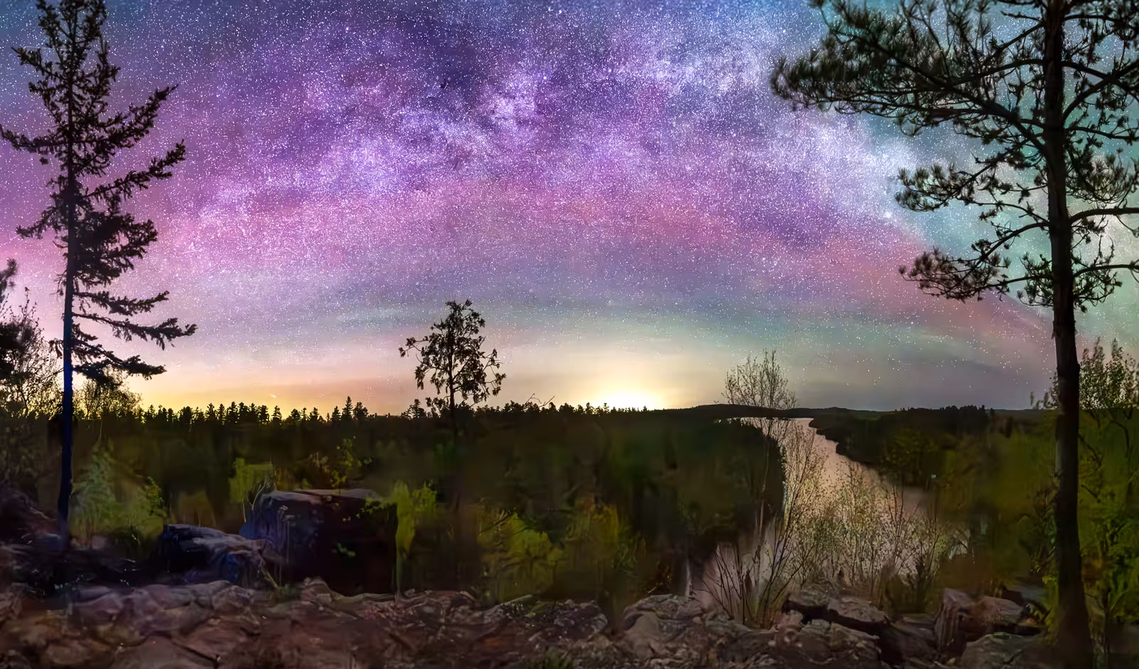 I was in Grand Marais MN and the Aurora is always so 'intrusive" on the Milky Way. This time the colors just could not be ignored. Between the yellow of the light pollution and the green of the glow to the pink of the aurora this was truly a rainbow!