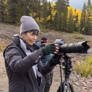 Susan refines her composition during our Fall Colors in Colorado Night Photography Workshop.