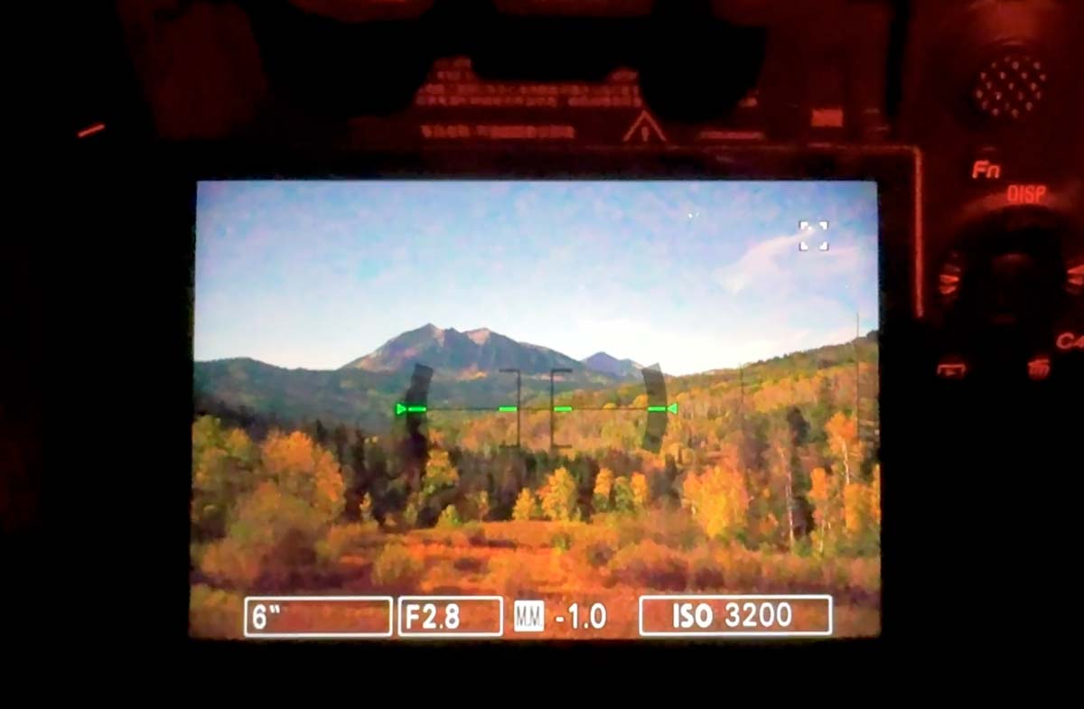 Sony a1 II Bright Monitoring showing a moonlit mountain and fall aspens as bright as day